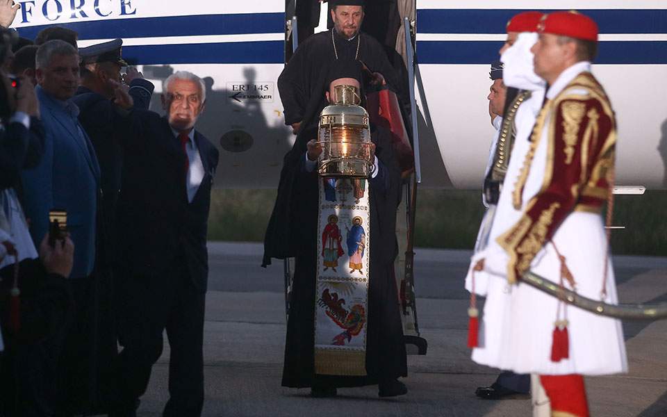Greek bishop skips holy flame’s arrival at military airport outside his see