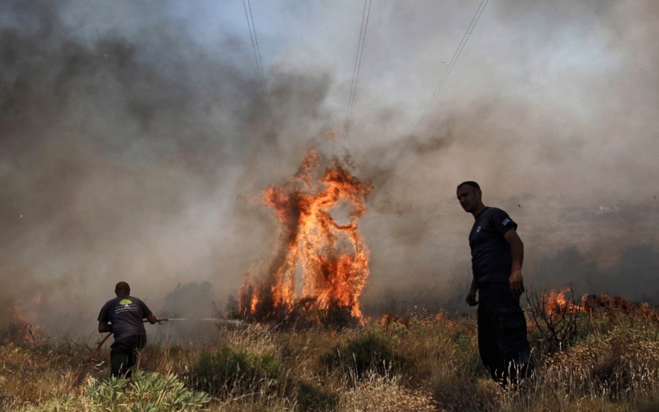 Greece beats back wildfires as one body found