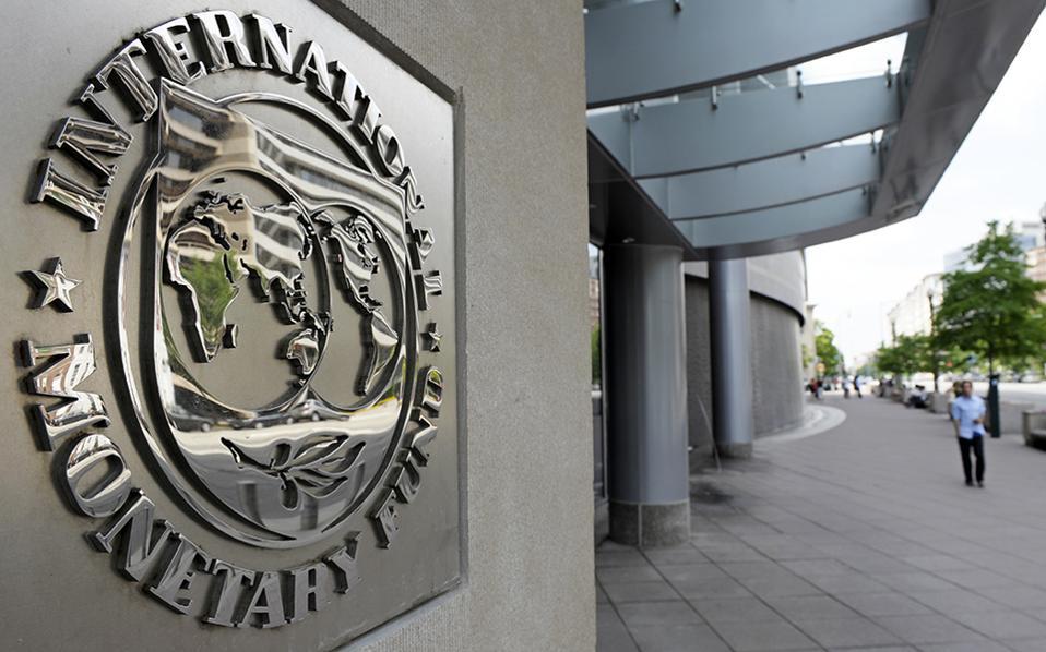 IMF says Greece made overdue payments, no longer in default