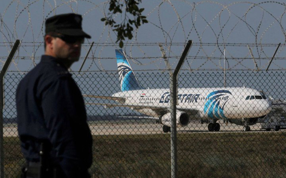 Standoff continues with hijacker at Cyprus airport, as hostages flee
