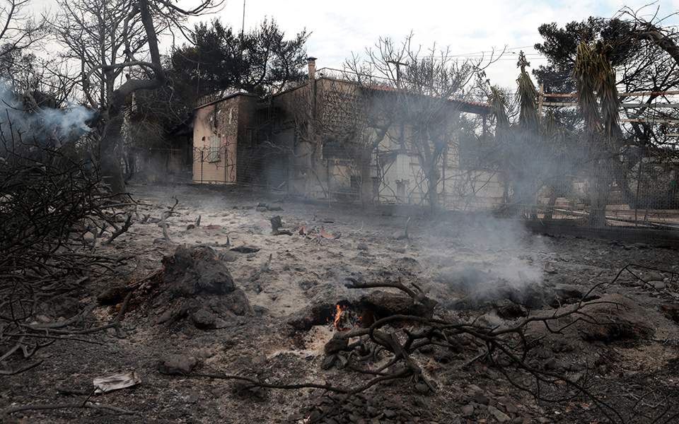 Woman whose family perished in Greek fire files lawsuit