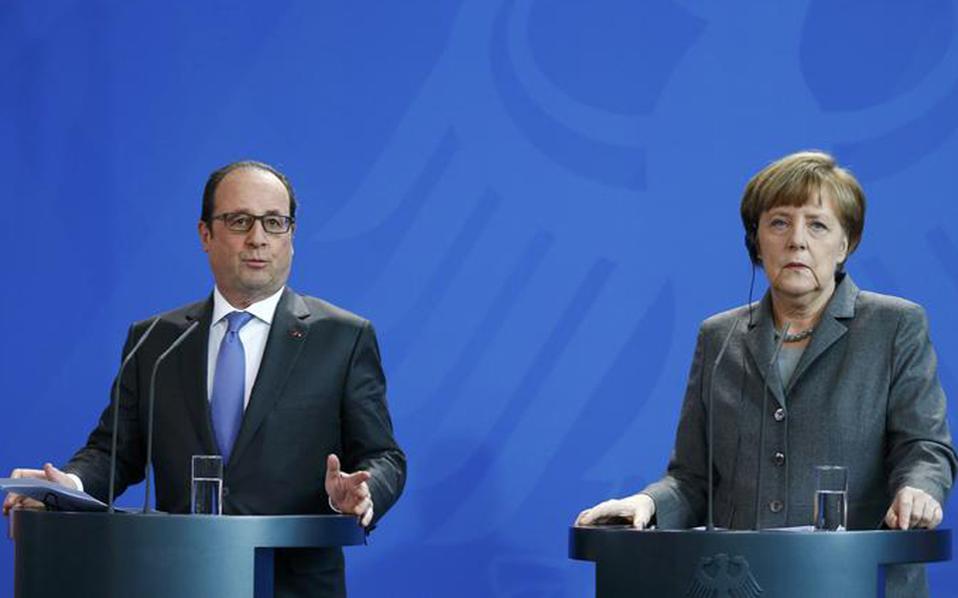 Hollande, Merkel stress migrant crisis needs EU solution