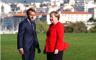 Behind fortress walls, Macron and Merkel to chart Europe’s course