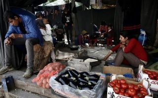 Tired of waiting, Greece’s migrants turn to business to survive