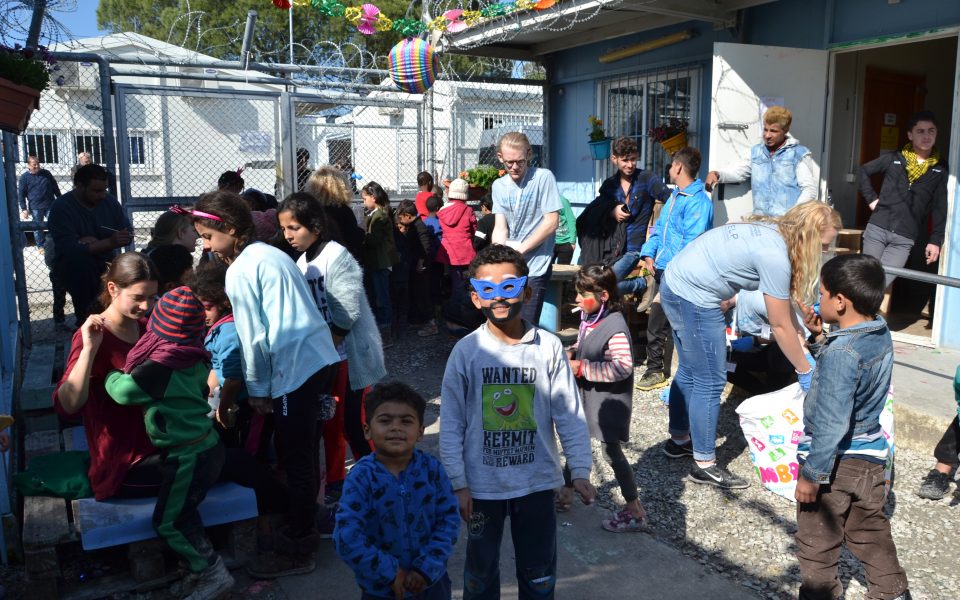 Volunteers help refugees dress up for Carnival at Moria