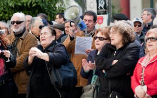 Pensions are cut for most Greeks