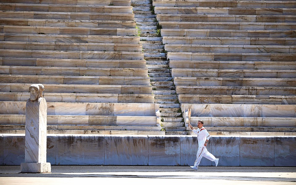Olympic flame starts an uncertain journey