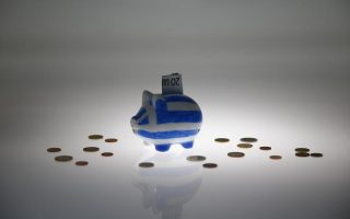 Factbox: Greece legislates bailout reforms to get loans, debt relief