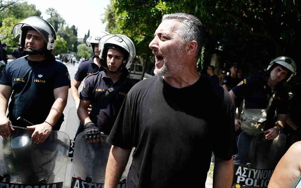 Striking garbage collectors march in Athens