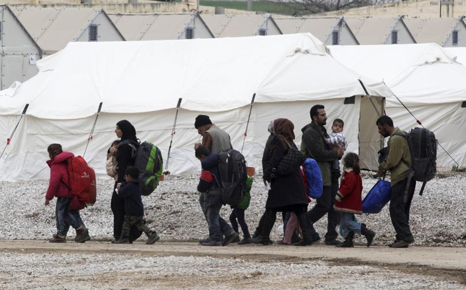 Aid groups seek action on migrants due to cold, tension erupts on Lesvos