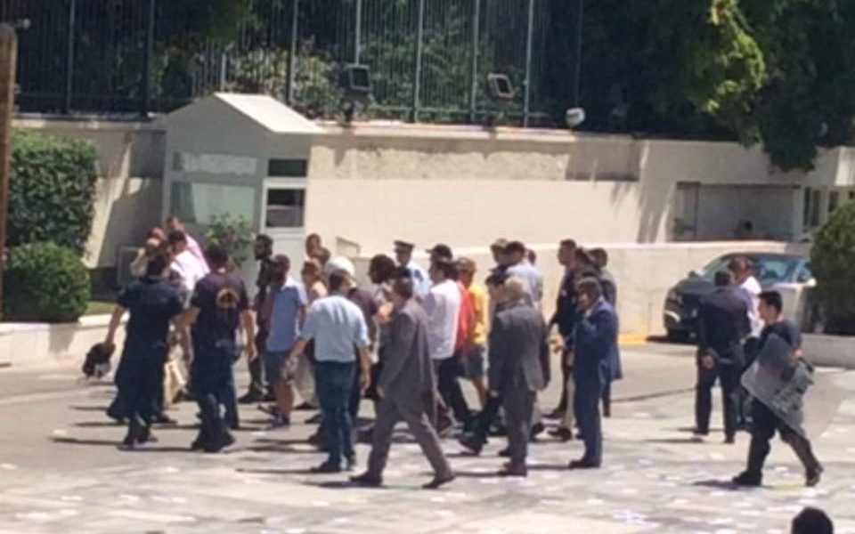Rouvikonas members enter Parliament’s courtyard