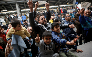 Train services disrupted as migrants stage sit-down at Larissis station