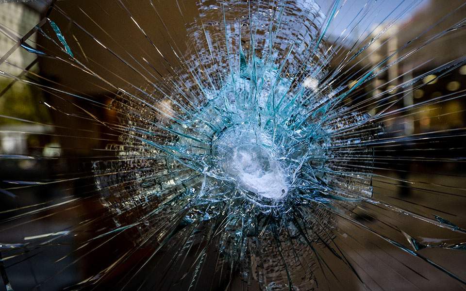 Vandals use sledgehammers to smash glass fronts of banks in central Athens