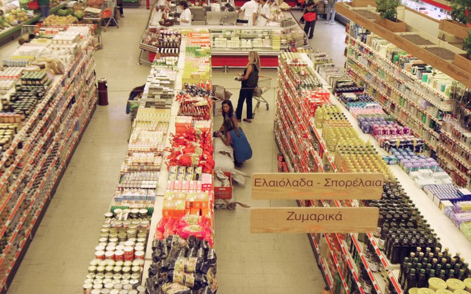 Miles from Athens, Greeks buy groceries for family back home