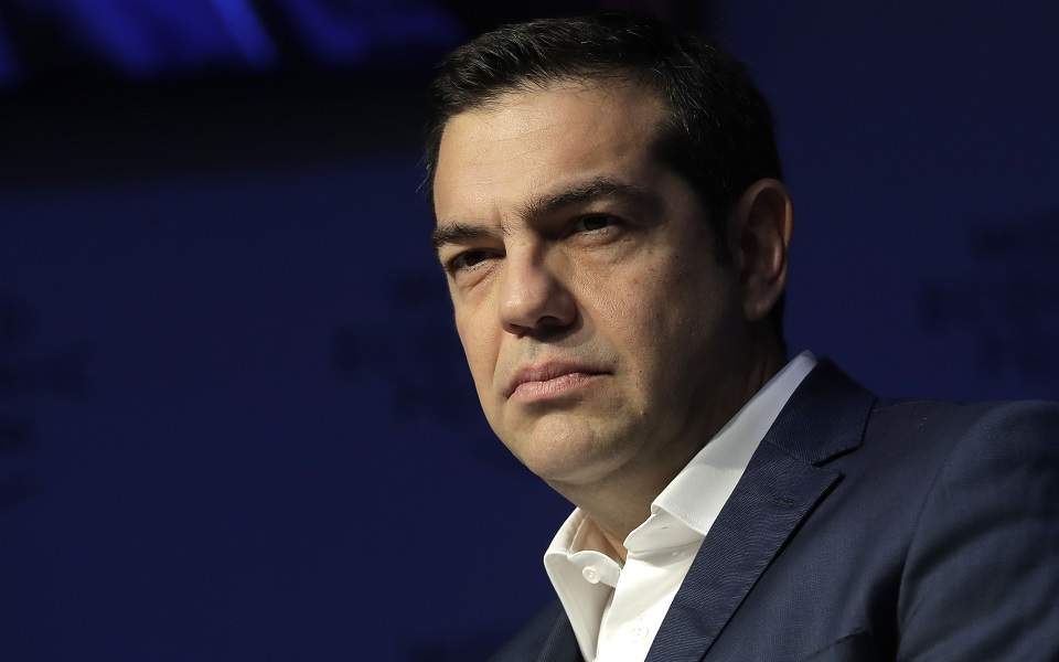 Greece has managed refugee crisis with ‘dignity,’ PM tells panel in Davos