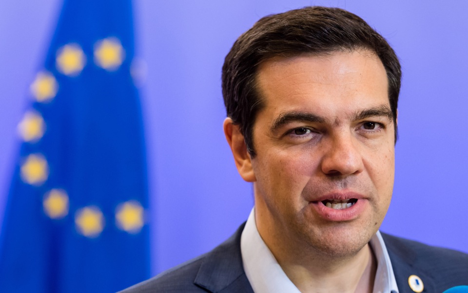Tsipras embraces troika while quelling Greek party rebellion