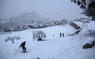 In Athens, rare snow blankets Acropolis, halts vaccinations