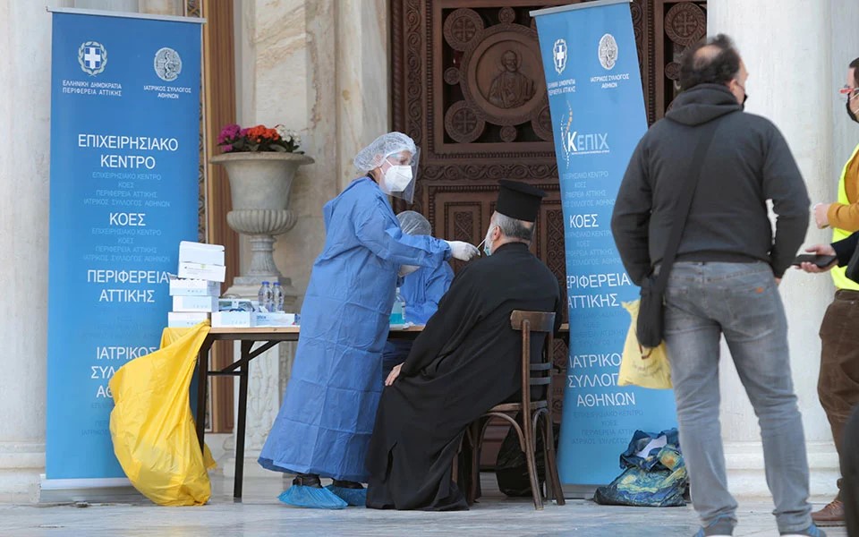 Priests queue for self-tests in Athens Metropolitan Cathedral