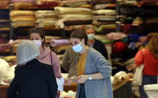 Stores open amid virus surge to help rescue economy