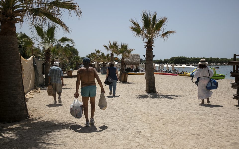 Hoping to lure back tourists, Greece reopens beaches after lockdown