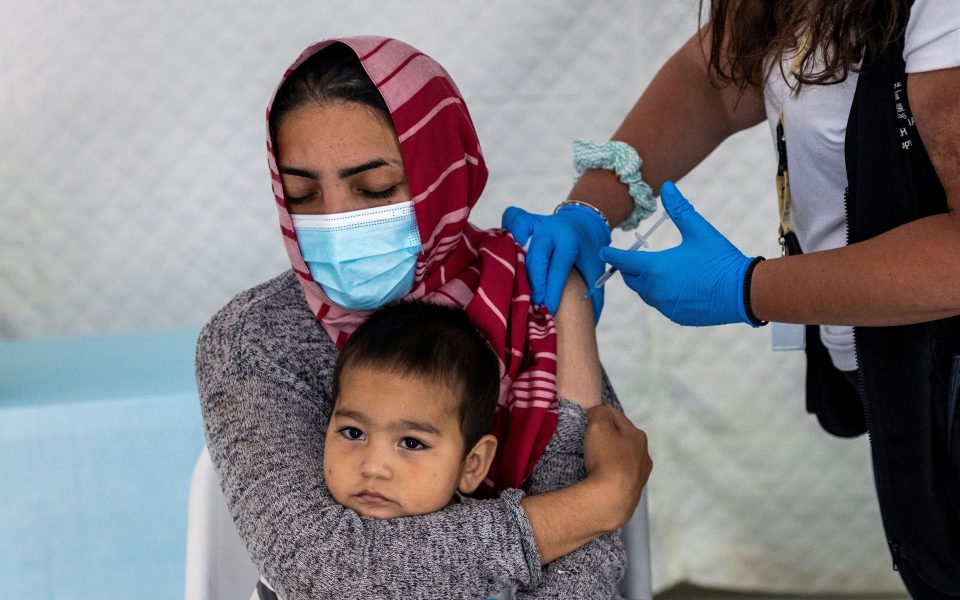 Greece rolls out Covid vaccines in migrant camps