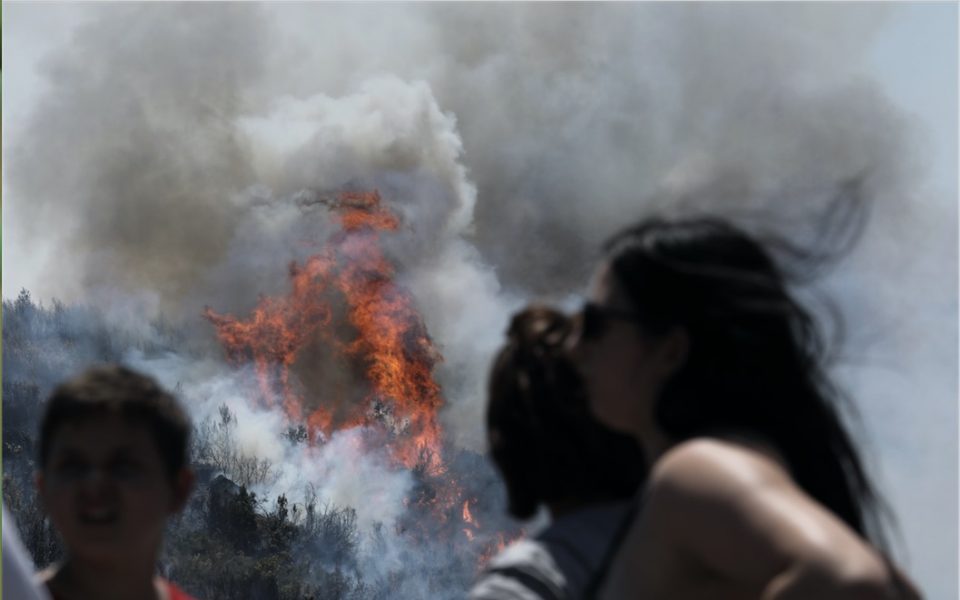 Wildfire forces village to evacuate in Evia; four more blazes raging