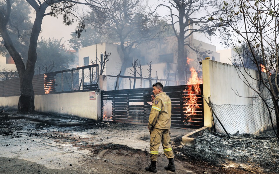 Dozens of homes are burned, countless people evacuated