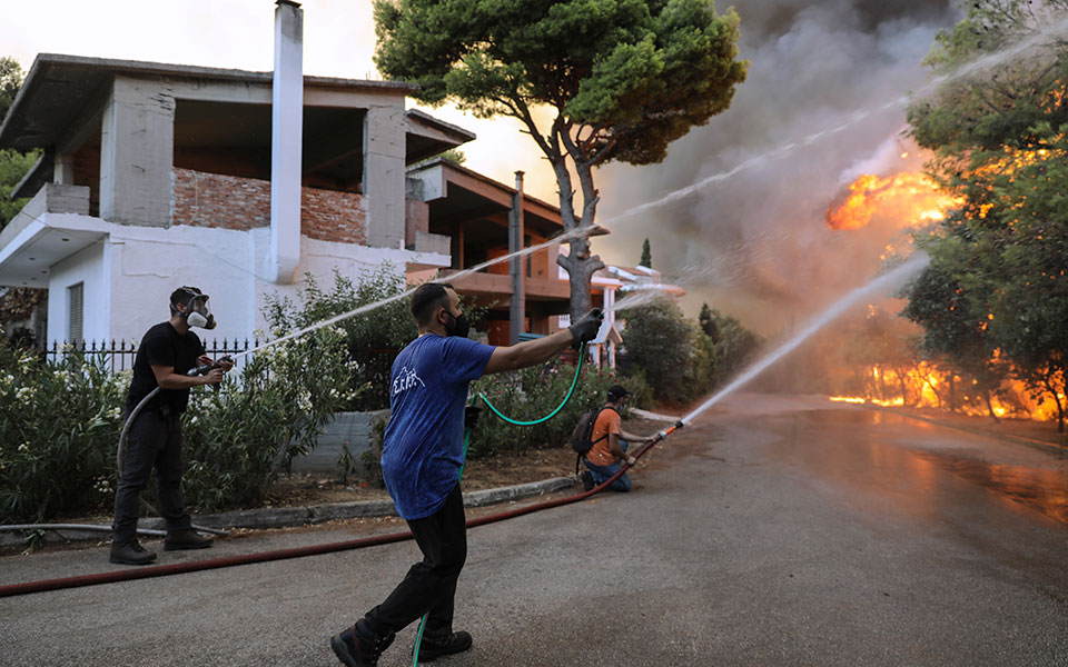 Thousands flee in Greece as wildfires sweep through Mediterranean