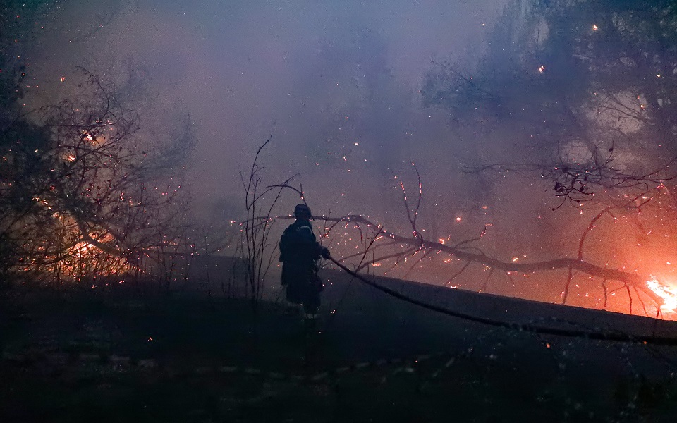 Firefighters continue to battle blazes as night falls