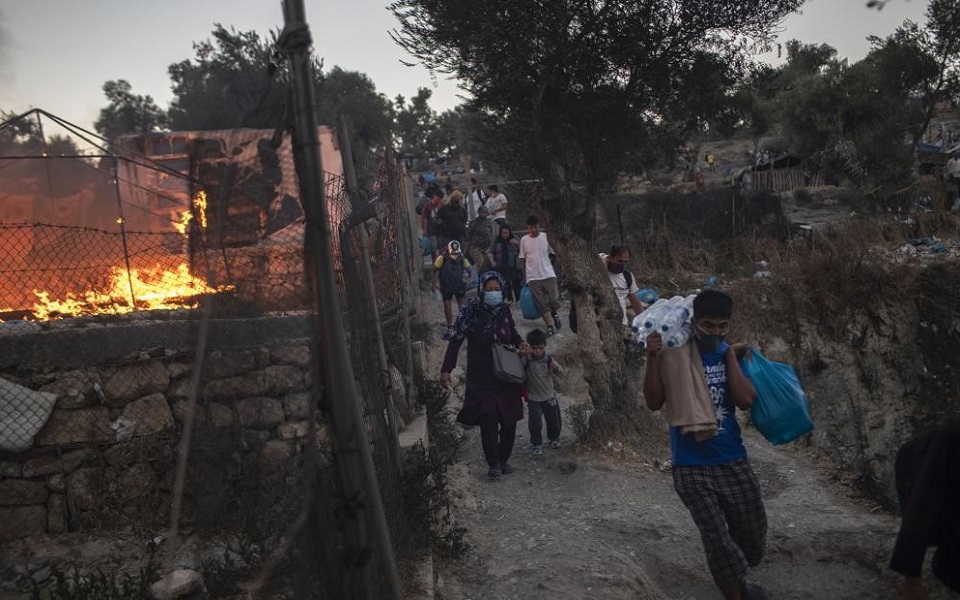 Aid groups decry migrant camp conditions a year after fire