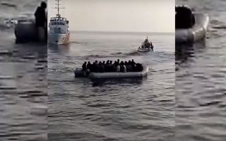Coast Guard says Turkish vessels tried to push migrant boat into Greek waters