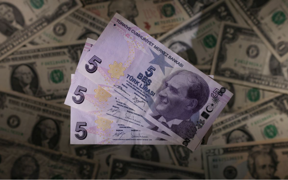 Turkish lira sliding toward record lows after rate cut