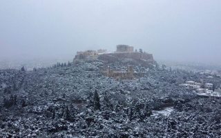 Soaring over snow-blanketed Athens