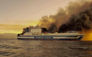 Two trapped in burning ferry, 11 others missing