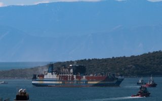 Fire-stricken ferry towed to mainland port