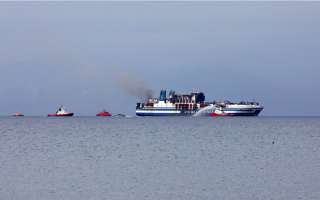 Body recovered from still burning ferry