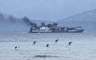 Greece halts search for 10 missing in ferry fire to tow ship