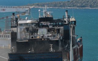 Removal of burned vehicles from two garages on stricken ferry completed
