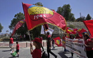Greek and Turkish Cypriots march together on May Day