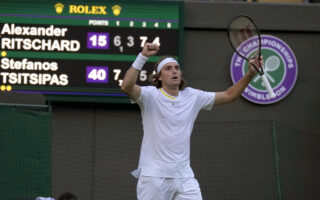 Tsitsipas wriggles out of trouble to reach Wimbledon second round
