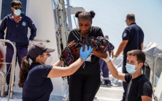 Stranded on tiny Greek island, migrant mother gives birth