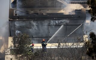Wildfire rages in southern Athens, damages homes