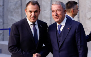 Greek, Turkish defense ministers meet briefly in Brussels