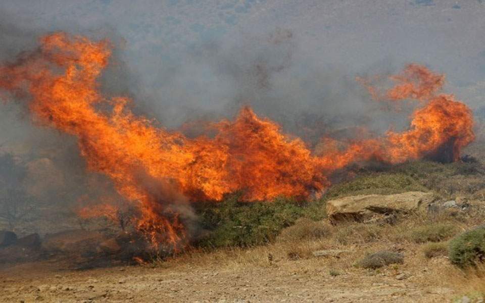 Man suffers burns as wildfire rages on Crete