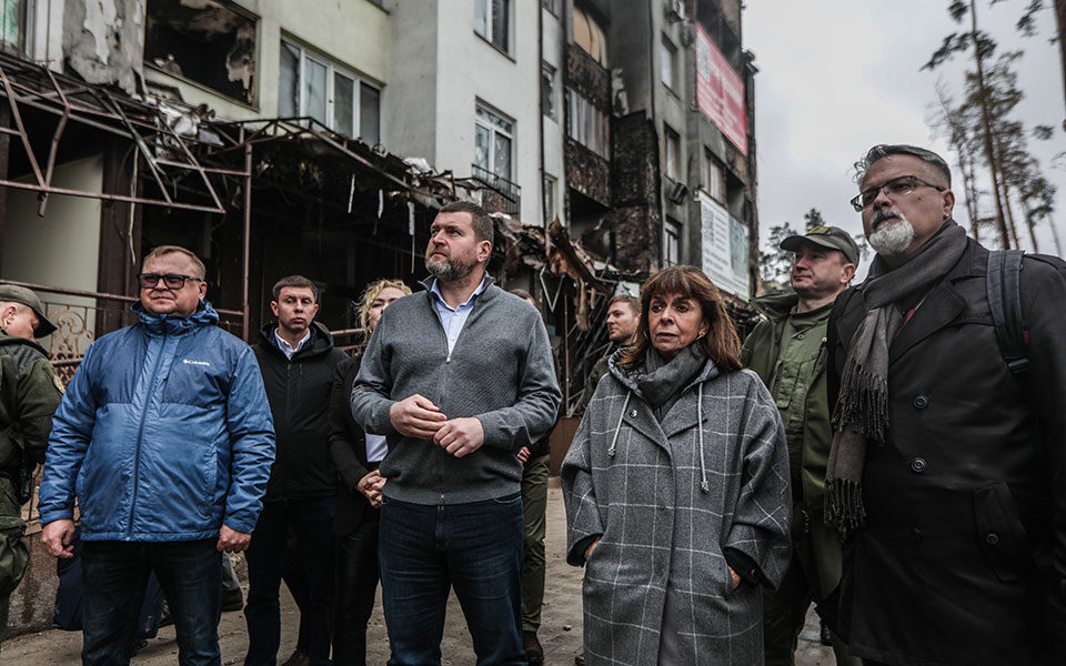 In Ukraine, Greek president visits bombed-out cities