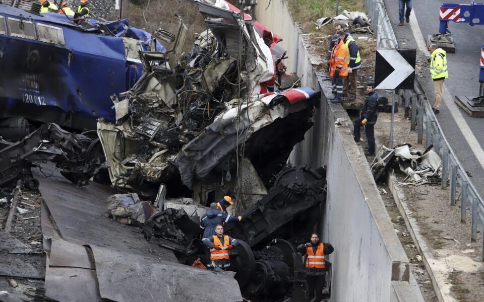 Rescuers comb through train crash wreckage as hopes fade