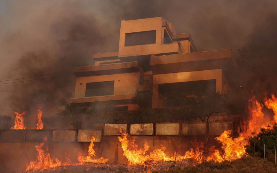 Wildfires rage near Greek capital, houses damaged