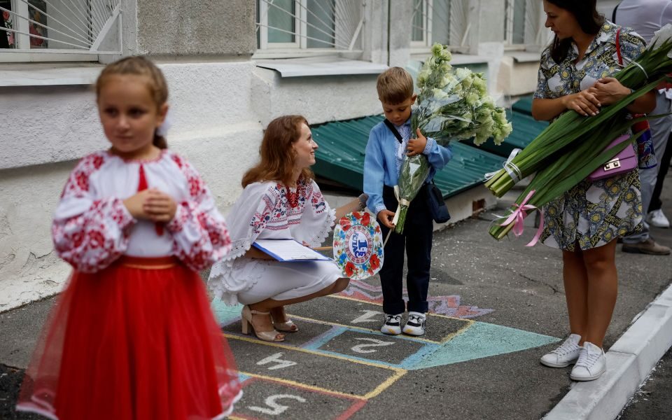 Ukrainian children head below ground at start of new school year