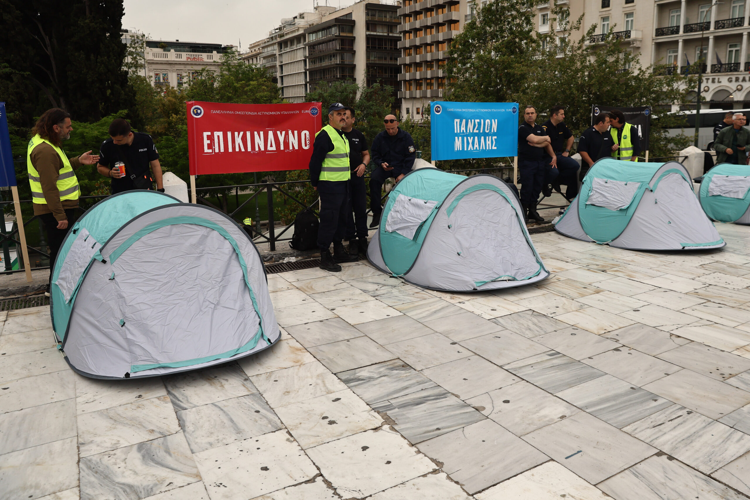 Police officers set up tents in Syntagma Square, protest budget cuts image
