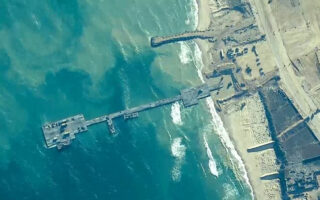 Aid begins to arrive in Gaza via US-built pier